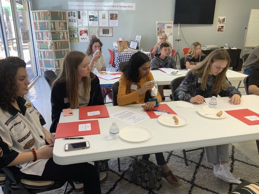 Teens at tables in the Laura Riding Jackson office on 14th Avenue in Vero Beach